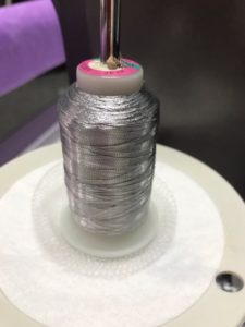 Thread net formed into a bowl.